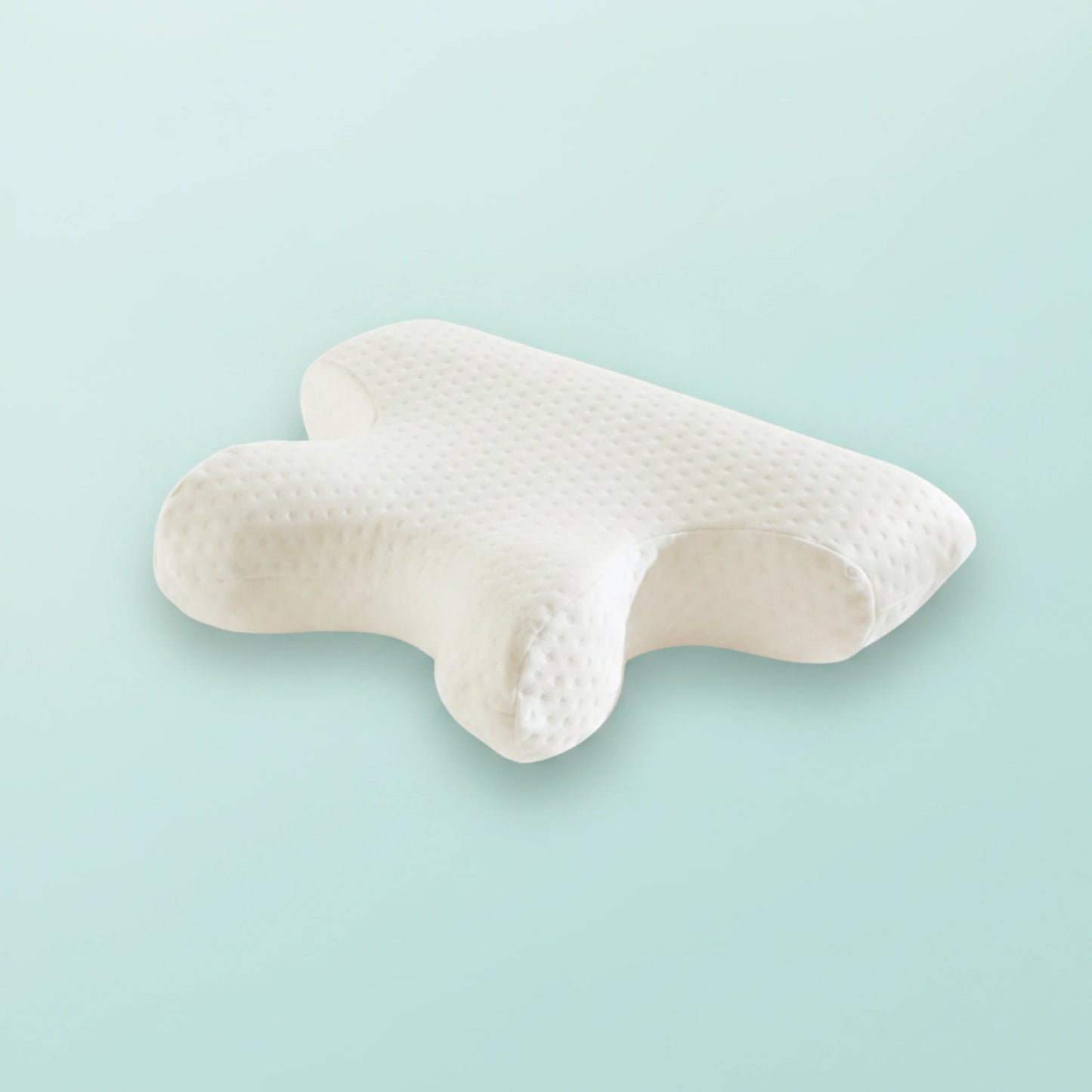 Poduszka CPAP do snu z maską i aparatem, na miętowym tle